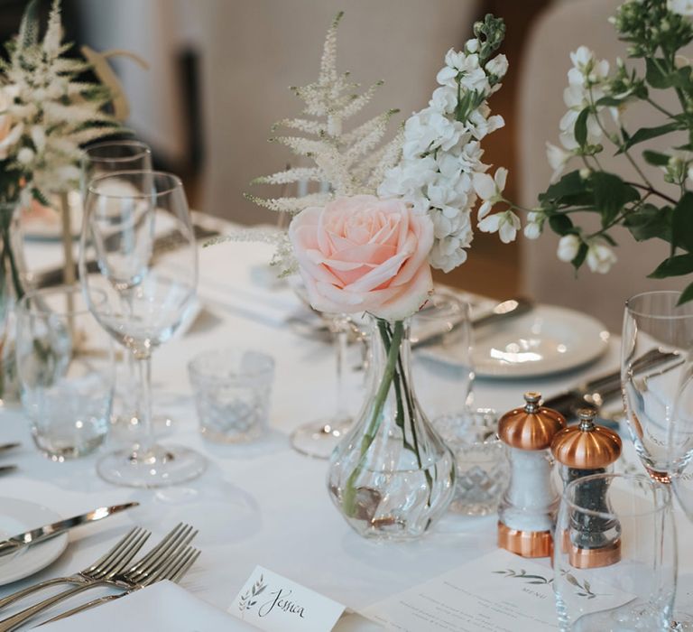 Blush Roses and Foliage in Bud Vases | Papier Place Cards | Mint Box Favours | Statement Floral Arrangement Altar and Potted Plants with Copper Frame Table Plan and Lace Jacket | Miss Gen Photography