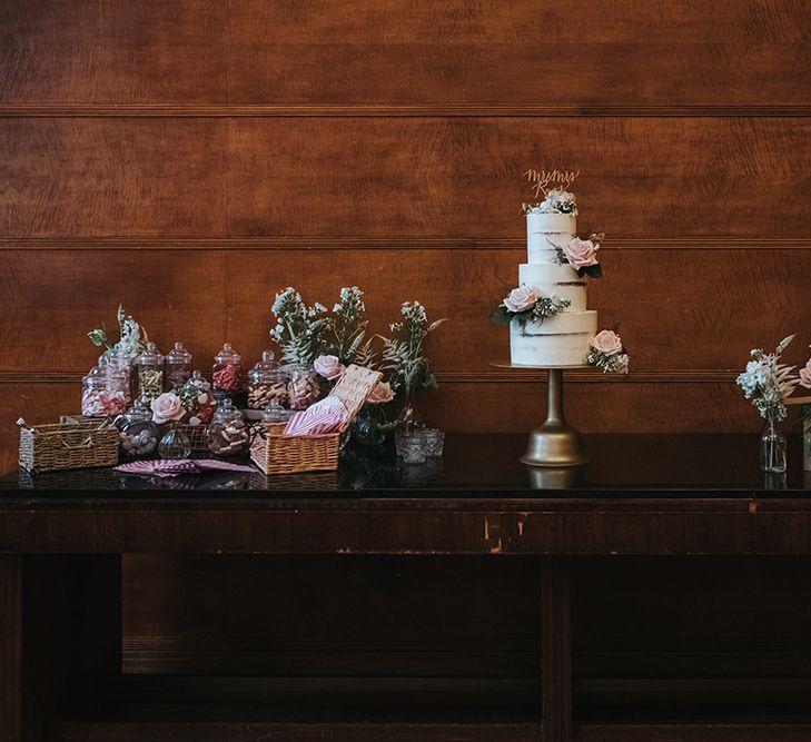 Three-Tier Semi-Naked Wedding Cake on Gold Stand with Fresh Flowers | Gold Calligraphy Cake Topper | Retro Sweet Bar | Cards Box | Calligraphy Guestbook Sign | Bud Vases with Blush Roses | Statement Floral Arrangement Altar and Potted Plants with Copper Frame Table Plan and Lace Jacket | Miss Gen Photography