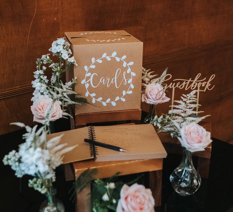 Cards Box | Calligraphy Guestbook Sign | Kraft Paper Guestbook | Bud Vases with Blush Roses | Statement Floral Arrangement Altar and Potted Plants with Copper Frame Table Plan and Lace Jacket | Miss Gen Photography