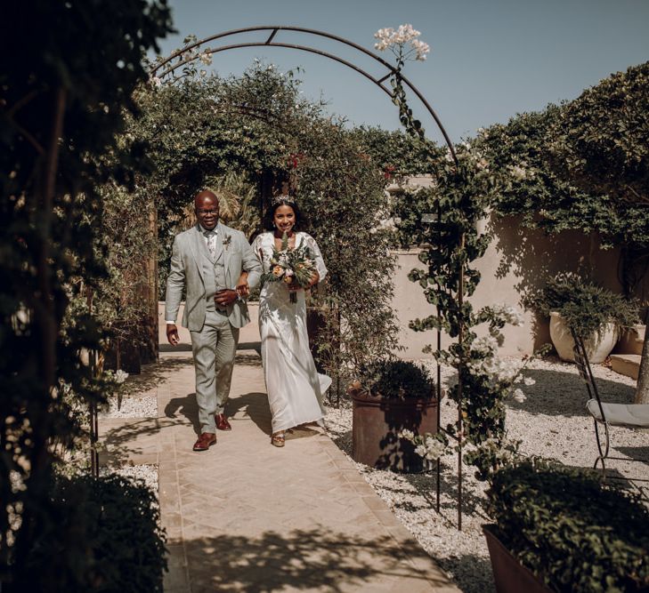 Outdoor wedding ceremony bridal entrance in Grace Loves Lace wedding dress