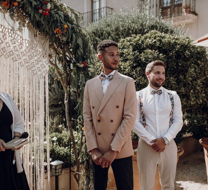 Groom standing at the altar in double breasted blazer