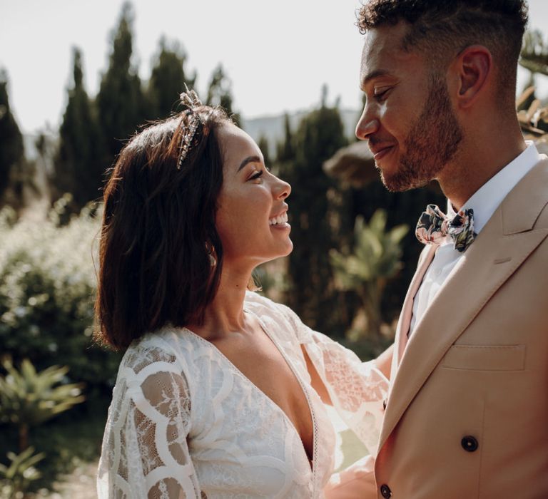 Intimate wedding portrait with bride in Grace Loves Lace dress