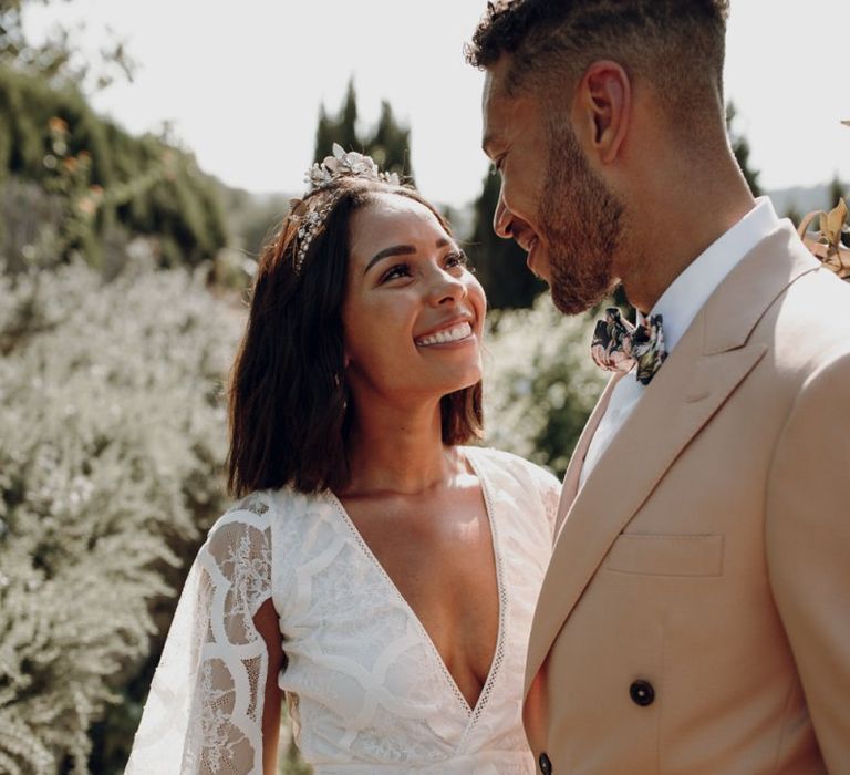 Boho bride in Grace Loves Lace dress and Tilly Thomas Lux Crown  smiling at her groom