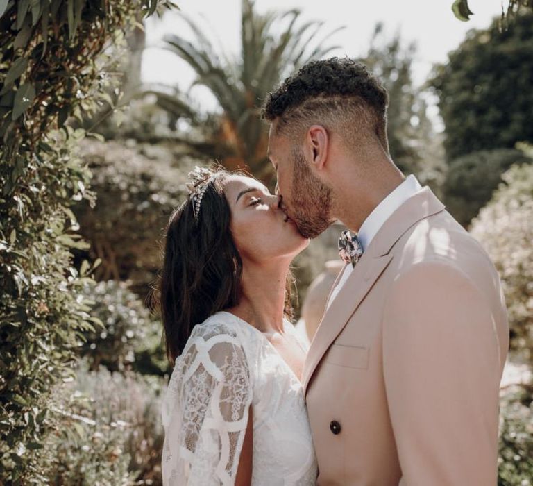 Bride and groom kissing at Spanish destination wedding