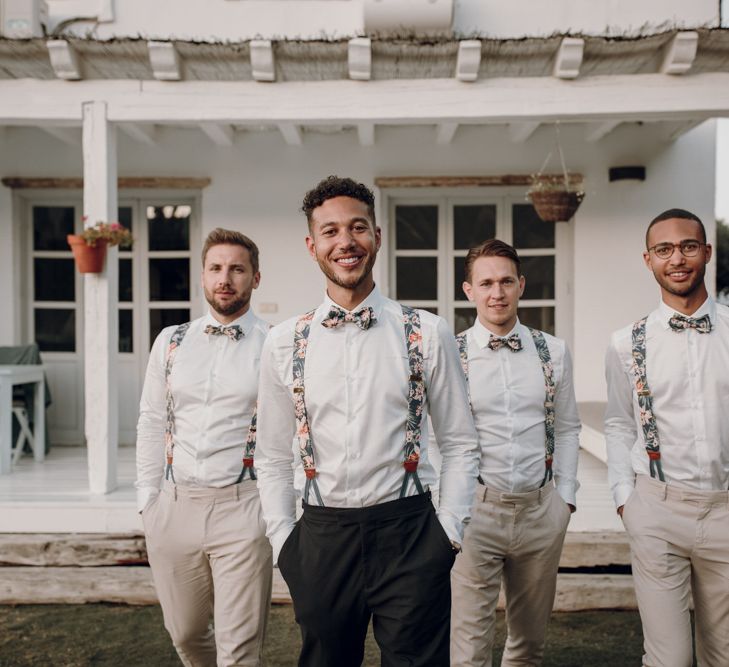 Groomsmen in floral braces and bow ties