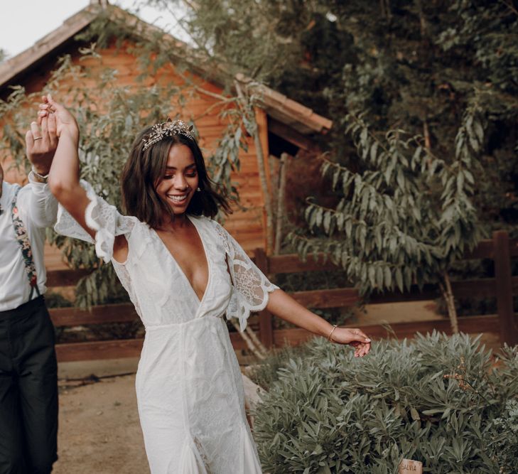 Boho bride and groom dancing