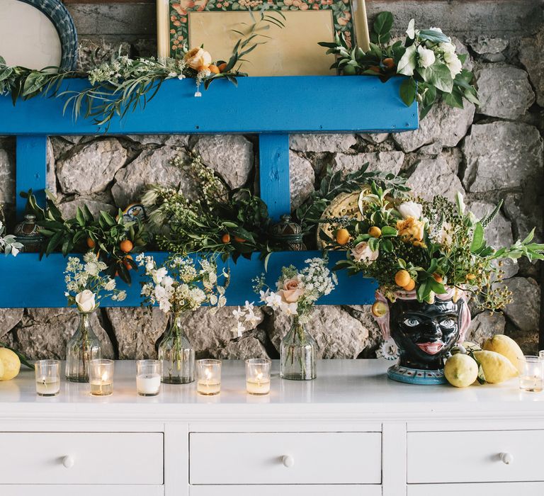 Wedding Sideboard Decor with Floral Arrangements and  candles