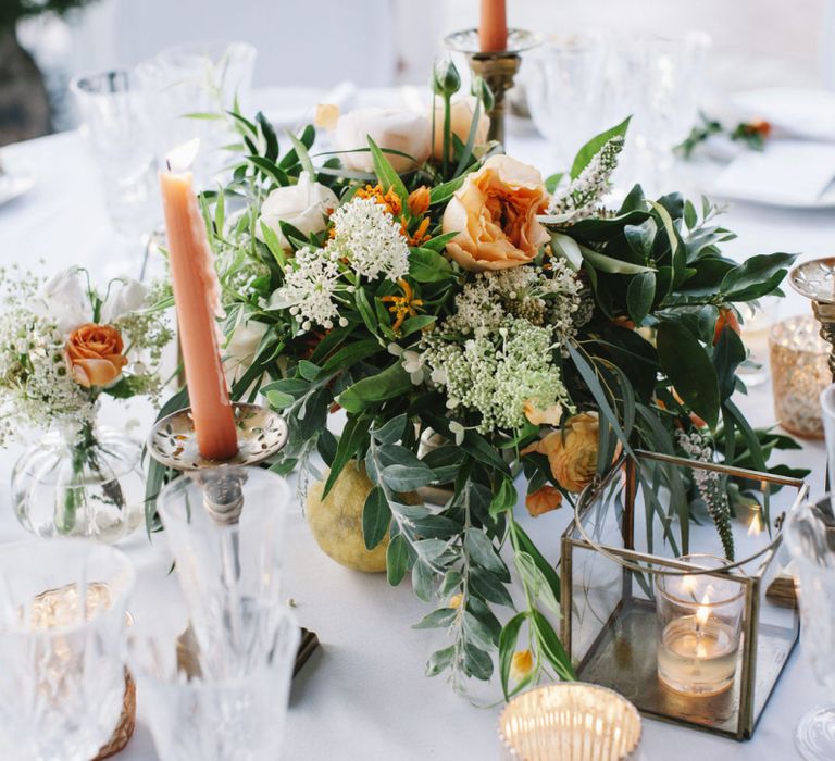 Tea Light &amp; coloured Taper Candles and Peach, White and Green Flower Arrangement