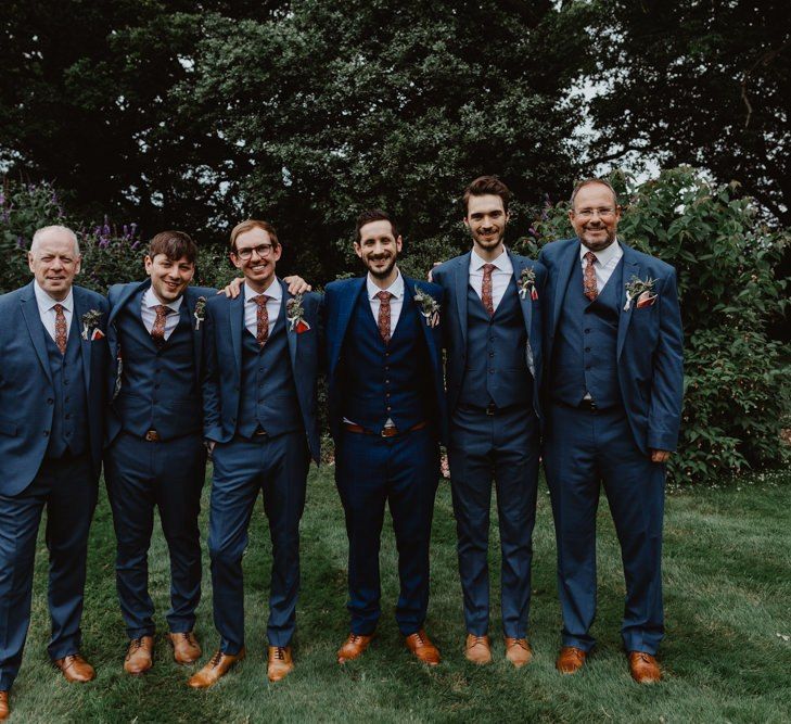 Groom and Groomsmen In Matching Navy Suits With Brown Shoes