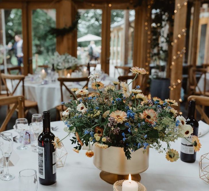 Rustic Wedding Venue  With Wildflowers Table Decoration