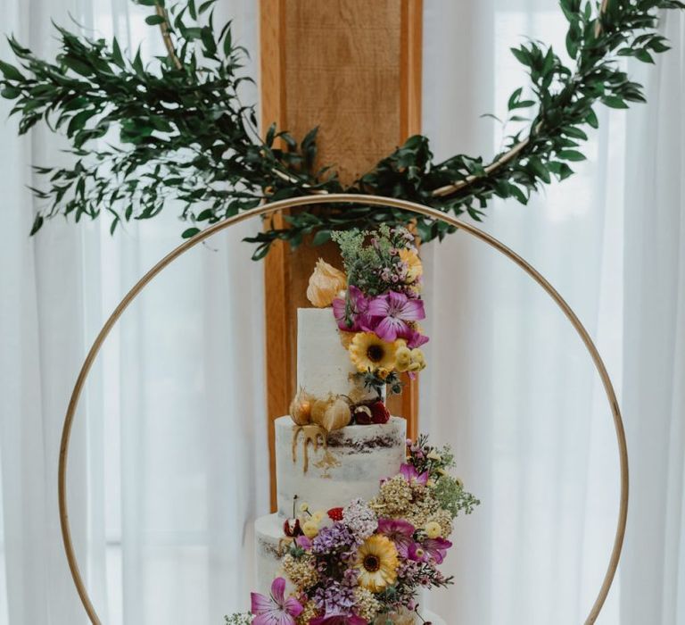 Wildflower Tiered Wedding Cake With Hoop Decor