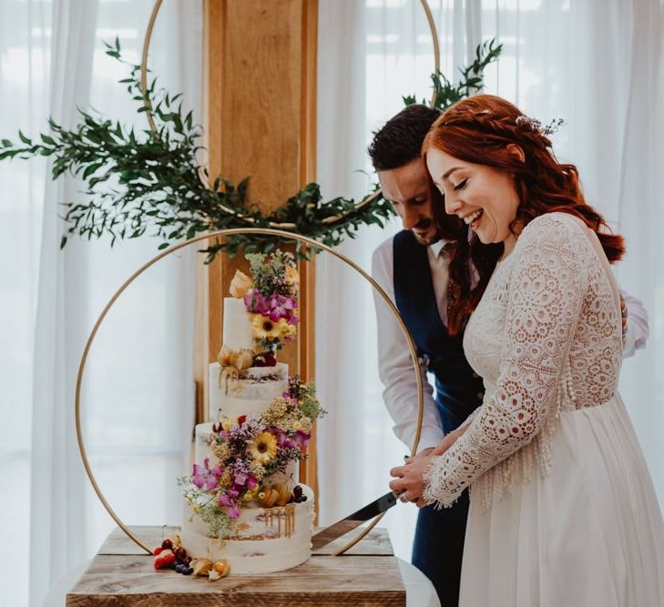 Bride and Groom Cut The Wedding Cake