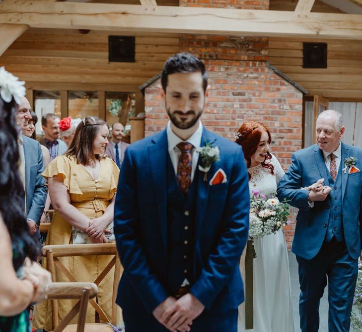 Bride Walking Down the Aisle In Lace Dress And Groom Waiting