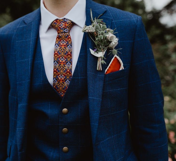 Blue Moss Bros With Buttonhole, Waistcoat and Patterned Tie