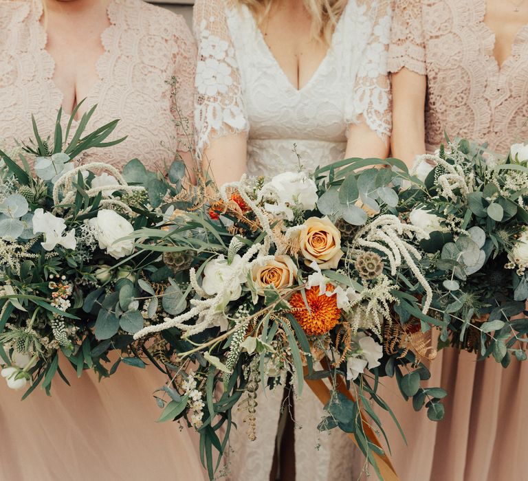 Bridal Party Bouquets with White and Orange Flowers and Foliage