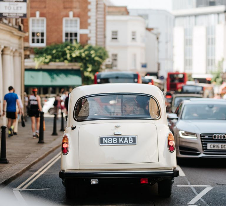 Bridal car driving through Richmond towards Kew Gardens wedding