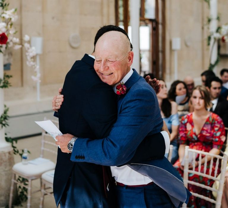 Groom greets guests at Kew Gardens wedding ceremony