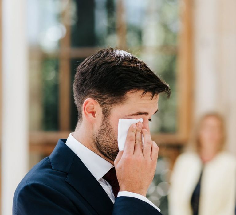 Groom wipes away tears as he sees bride for first time at Kew Gardens wedding