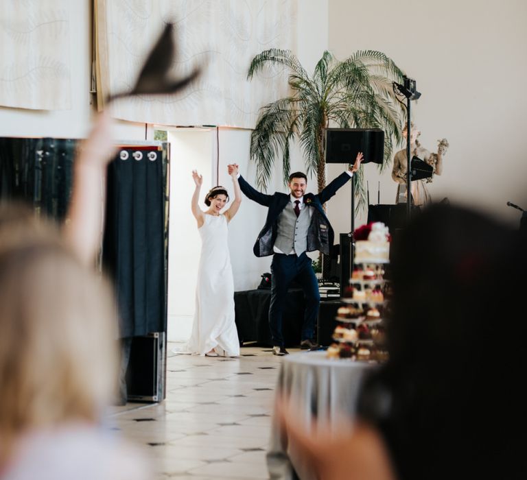 Bride and groom make their epic entrance at wedding breakfast