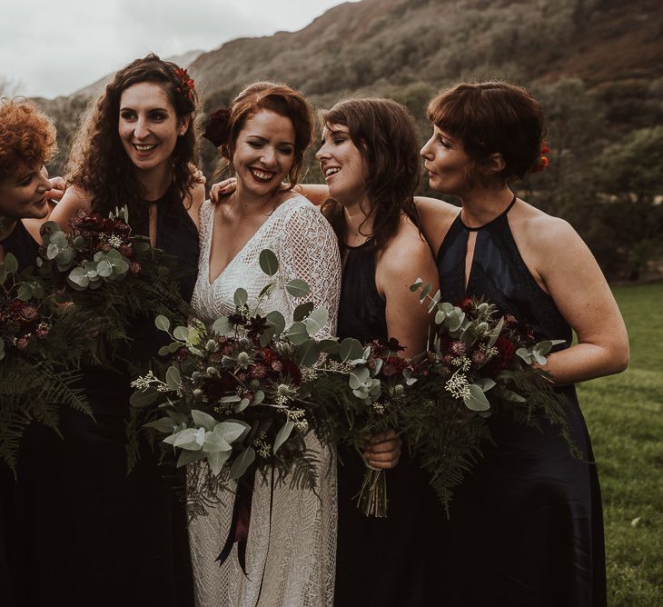 Navy Bridesmaid dresses with foliage bouquets