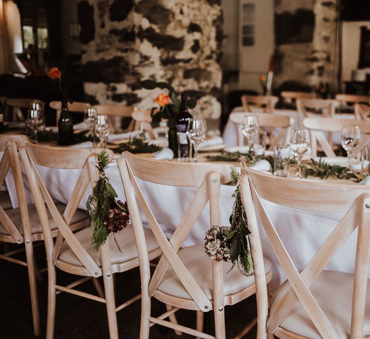 Wedding table decor with simple wedding flowers and foliage