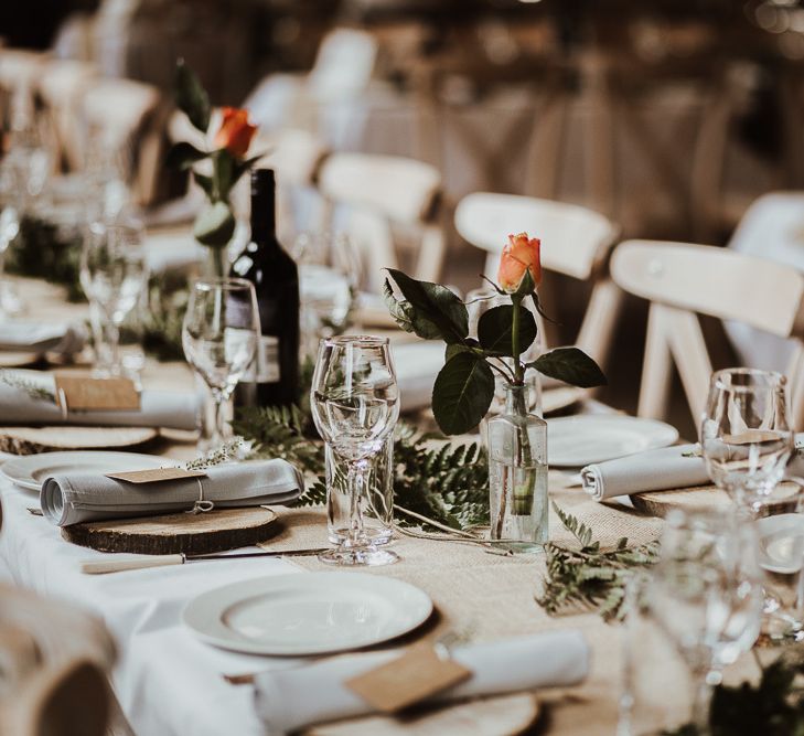 Wedding table decor with simple wedding flowers and foliage