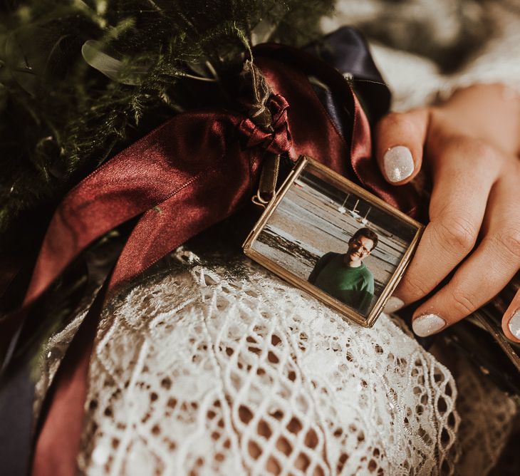 Loving photograph in memory of Dad attached to bouquet