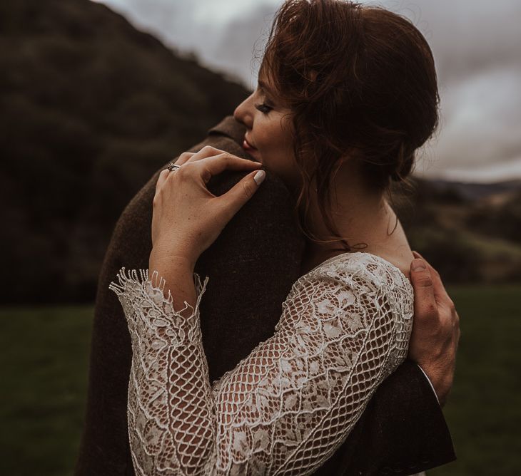 Bride and groom embrace