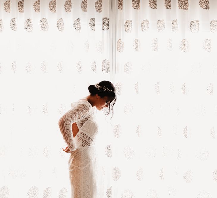 Bride in Lenora Dress by Wtoo Watters with Lace Sleeves and Keyhole Back | Prudence Halo Headpiece by Kelly Spence Wed | String Lights, Perspex Table Signs and Paper Cranes for Industrial Wedding | Frankee Victoria Photography