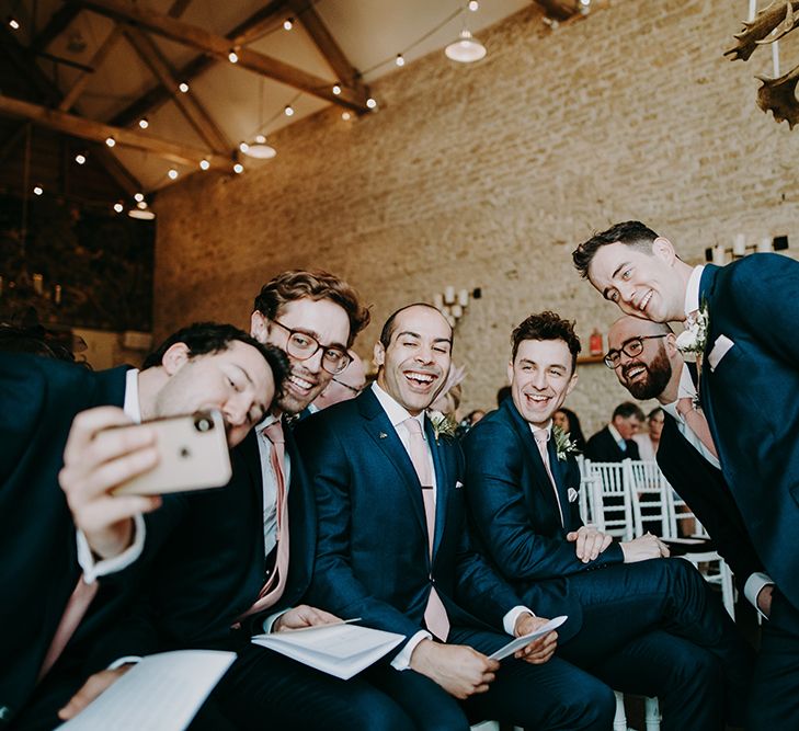 Groomsmen at the Altar in Navy Moss Bros. Suits Taking a Selfie