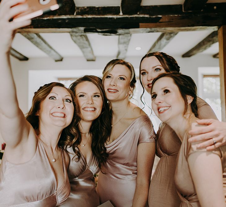 Bridesmaids in Pale Pink Ghost Dresses Taking a Selfie