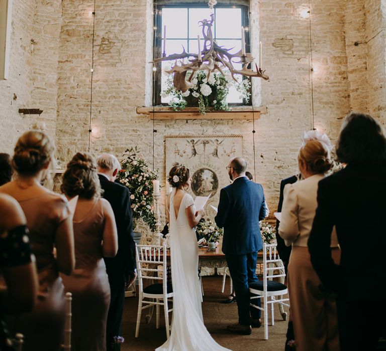 Wedding Ceremony at Merriscourt with Bride in Pronovias Dralan Wedding Dress  and Groom in Navy Blue Moss Bros. Suit