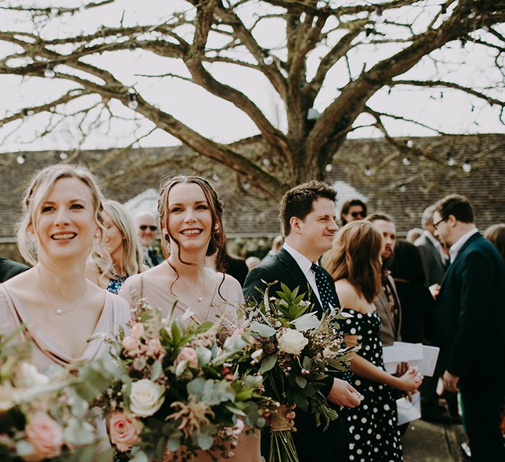 Bridesmaids in Pink Ghost Dresses Holding Romantic Bouquets