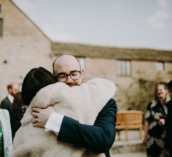 Groom being Congratulated by Wedding Guests