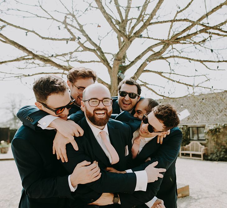 Groomsmen in Moss Bros. Suits with Pink Ties