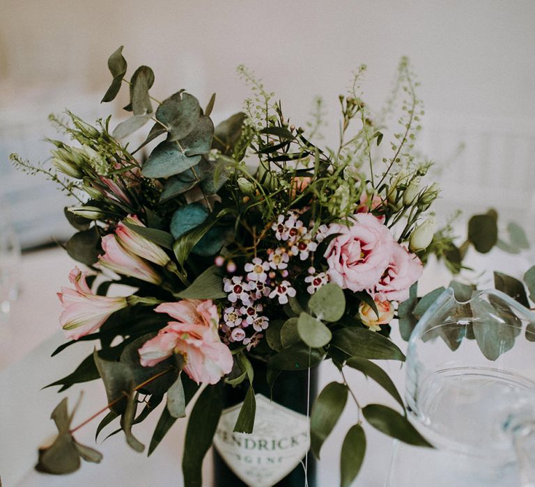 Wedding Flowers in Gin Bottles