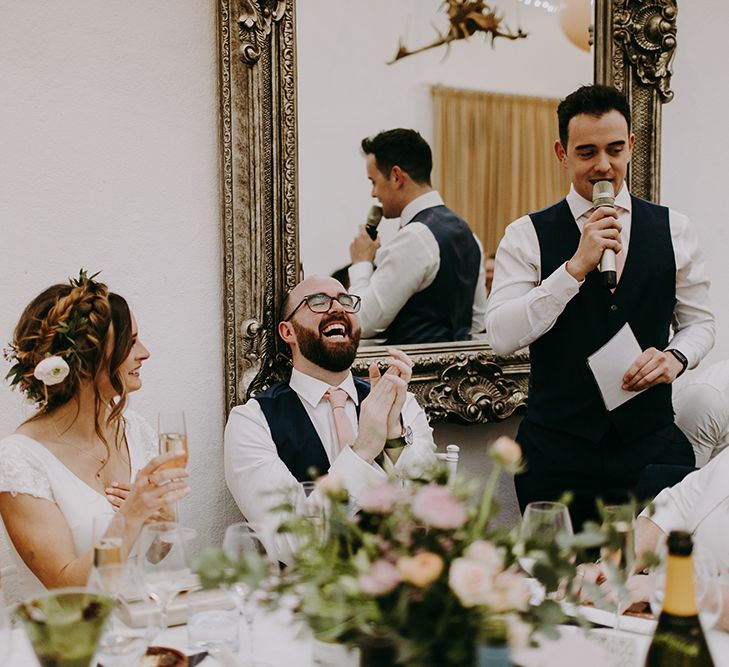 Bride and Groom Laughing During Best Mans Wedding Speech