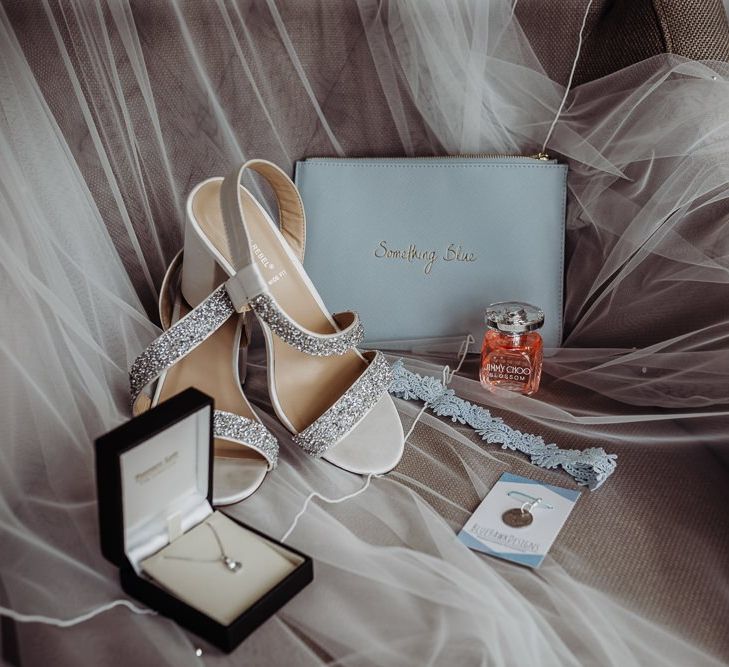 Bridal accessories and a 'something blue' bag at rustic barn wedding in The Cotswolds