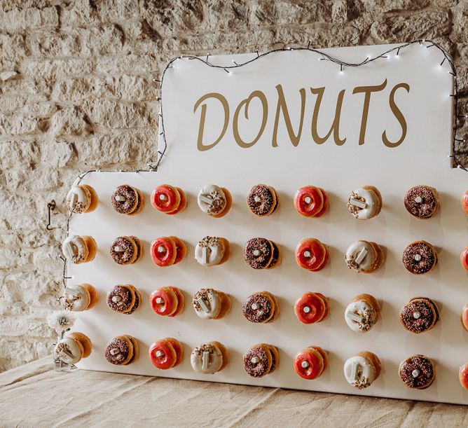 Rustic styled donut wall at Cogges Manor Farm wedding