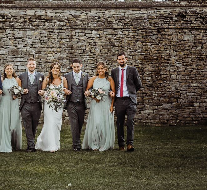 Bride and groom with their wedding party at Cogges Manor Farm