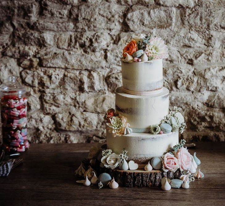 Rustic styled wedding with semi naked cake decorated with pastel florals