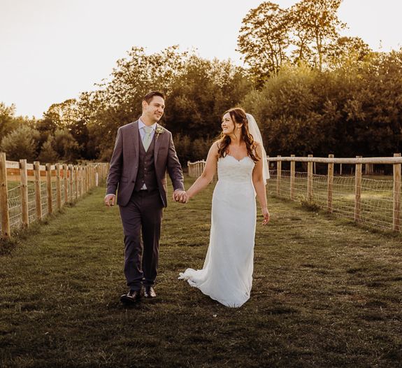 Bride and groom steal a moment to enjoy the views at their Cogges Manor Farm wedding