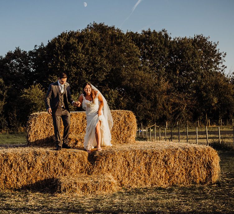 Making the most of their farm wedding the couple pose for some shots