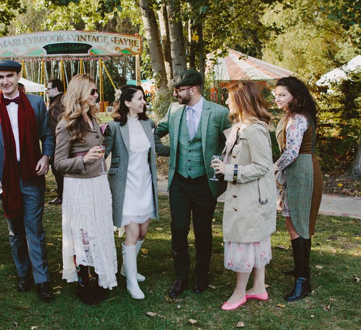 Relaxed group shot. British tweed countryside wedding complete with Vintage Fun Fair | Sandra Mansour Dress | Hunter Wellies | Marleybrook House | Hunter Wellies | Images by David Jenkins