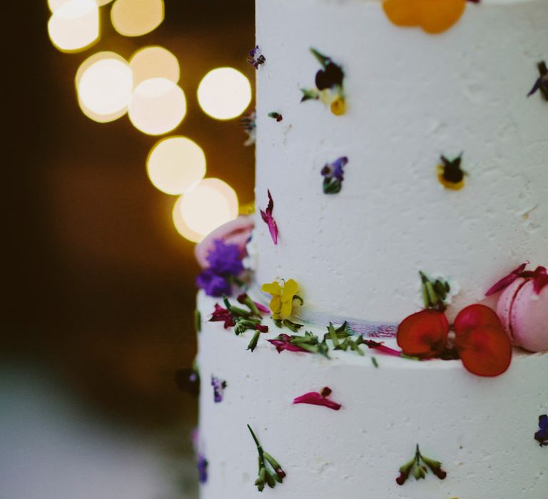 Cake with flowers. British tweed countryside wedding complete with Vintage Fun Fair | Sandra Mansour Dress | Hunter Wellies | Marleybrook House | Hunter Wellies | Images by David Jenkins