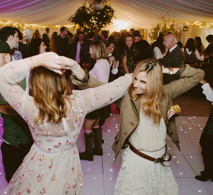 Dancing. British tweed countryside wedding complete with Vintage Fun Fair | Sandra Mansour Dress | Hunter Wellies | Marleybrook House | Hunter Wellies | Images by David Jenkins