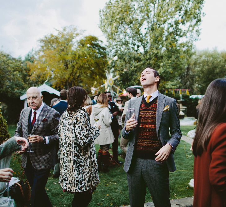 Laughter. British tweed countryside wedding complete with Vintage Fun Fair | Sandra Mansour Dress | Hunter Wellies | Marleybrook House | Hunter Wellies | Images by David Jenkins