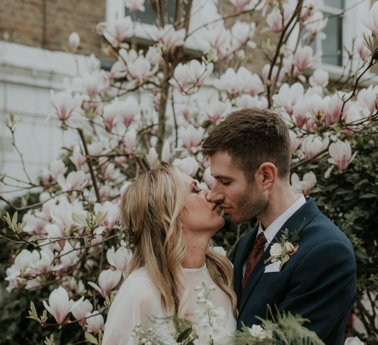 Wedding Cape On Stylish Bride With Groom