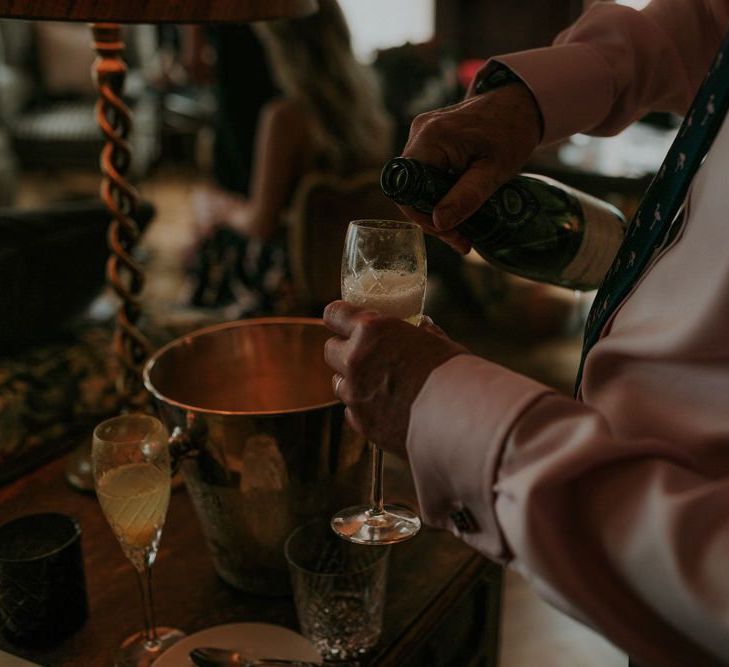 Guests Pour Champagne Before Church Ceremony