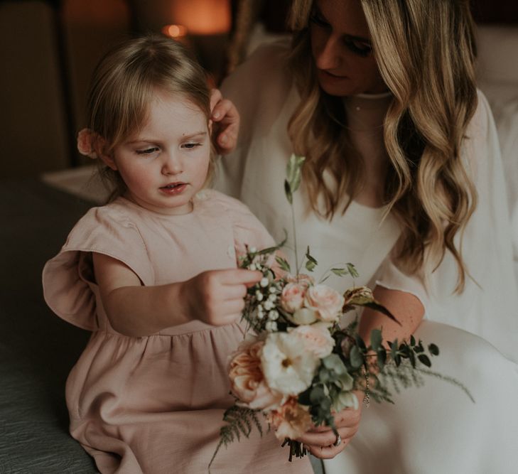 Bride In Wedding Cape Takes A Moment With Daughter Before Ceremony